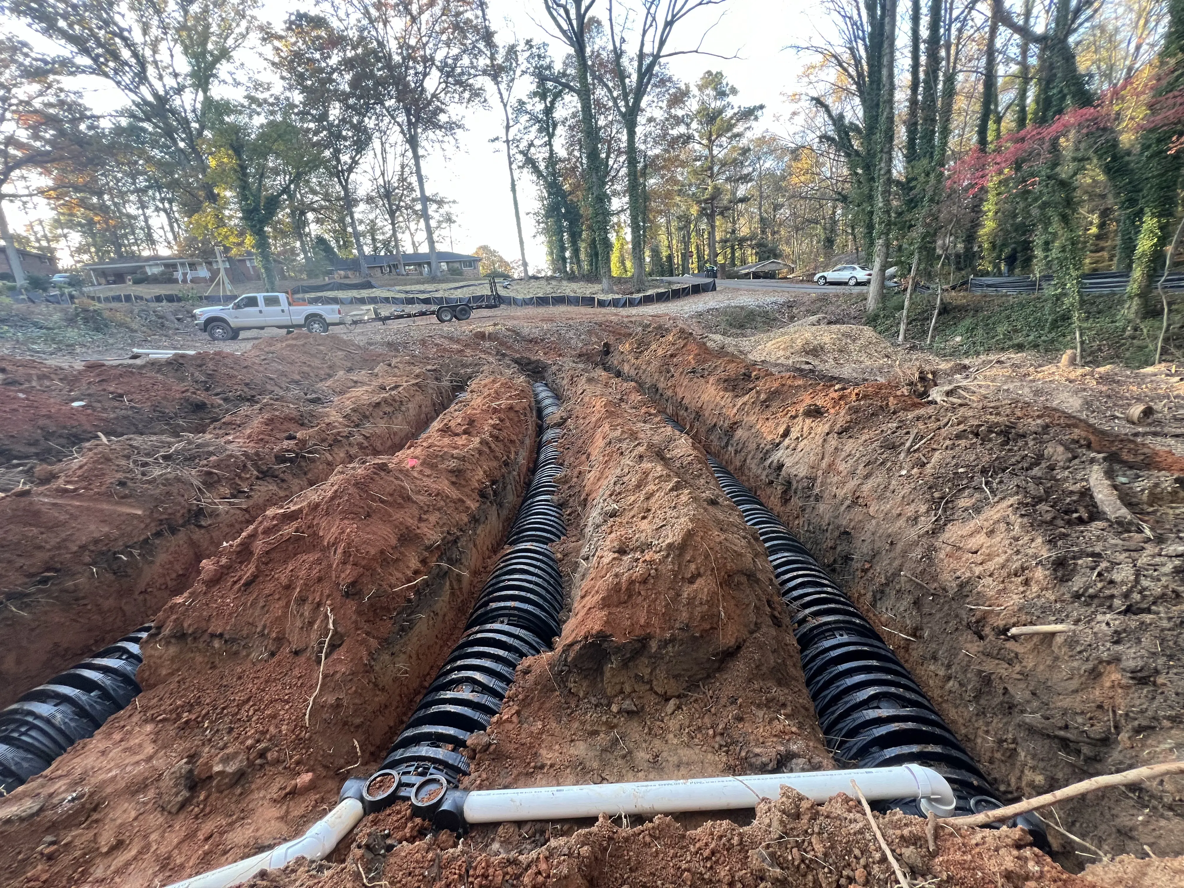 Excavated soil with drainage pipes installed in construction site